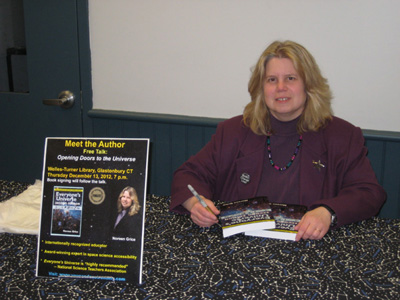 Noreen signing copies of her book