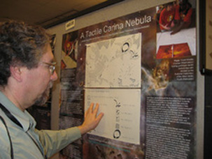 Scientists touching Tactile Carina Nebula