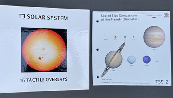 On the left side of this photo is a picture of the Touch the Solar System 3-ring-binder that holds the tactile images for this book. The white binder has an orange and yellow printed picture of the Sun with
sunspots. Above the Sun picture are the words, T3 Solar System and below the Sun picture are the words, 16 Tactile Overlays. To the right of the binder is one of the colorful tactile images from Touch the Solar System; a size comparison of the planets.